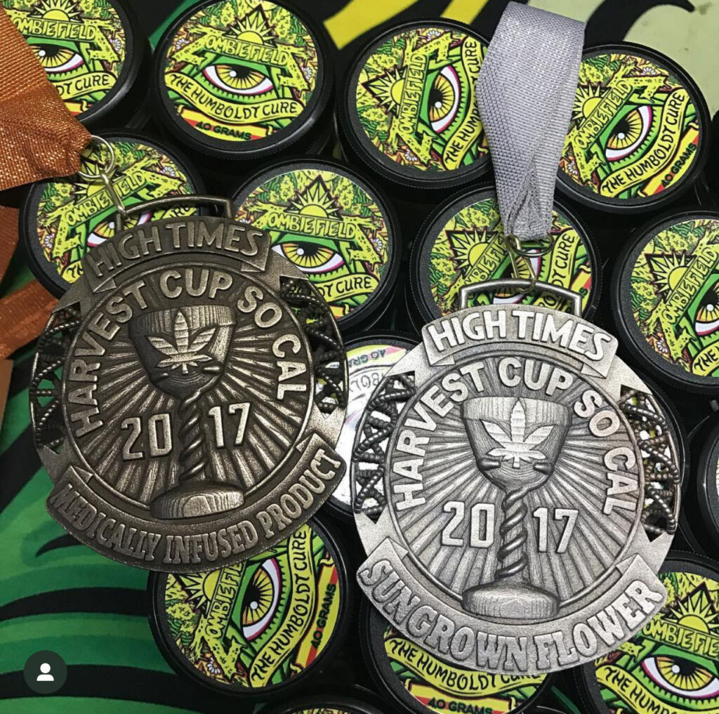 Close-up of 2017 Hickory High Time Cup medals in gold and silver.